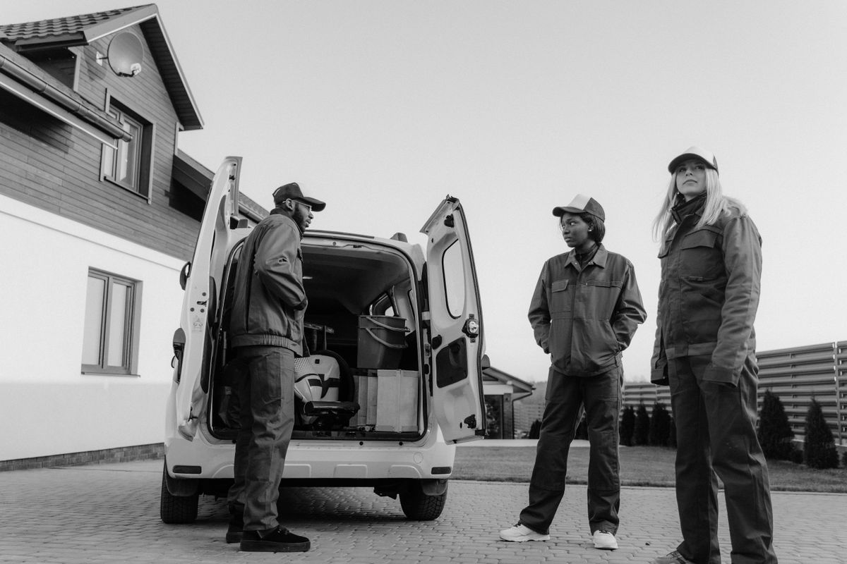 A service crew unloading a van at a customer's home